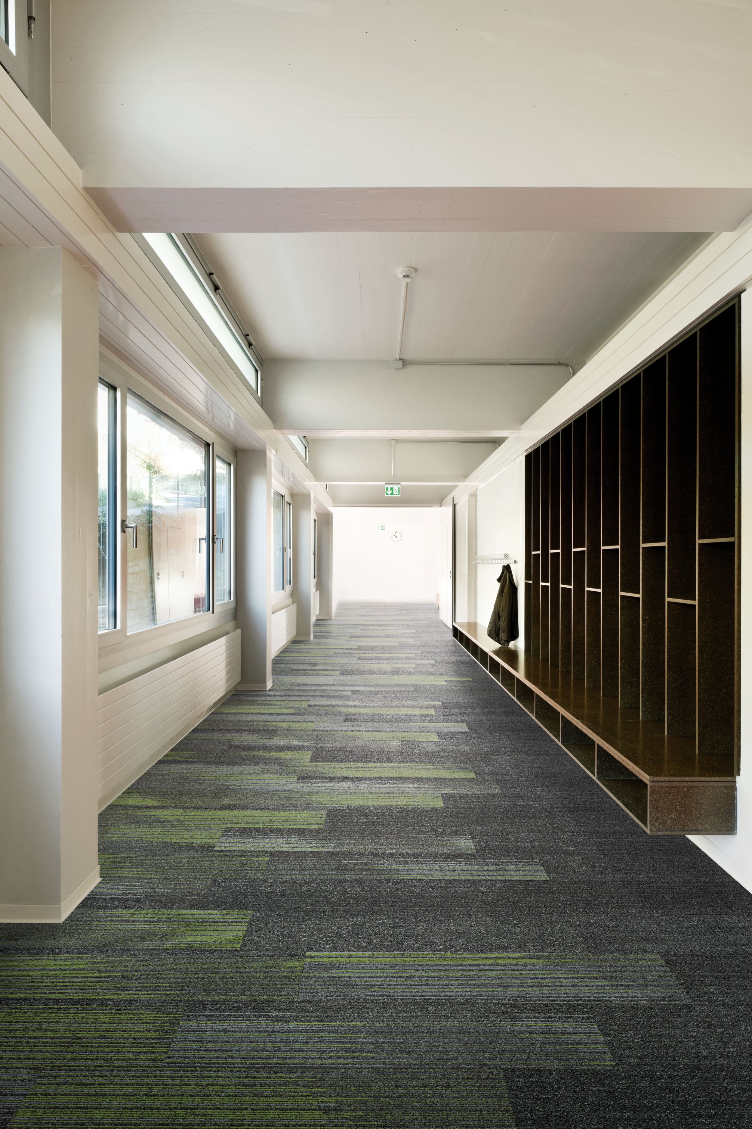 Interface Ground Waves Verse plank carpet tile in corridor with shelves lining one wall image number 5